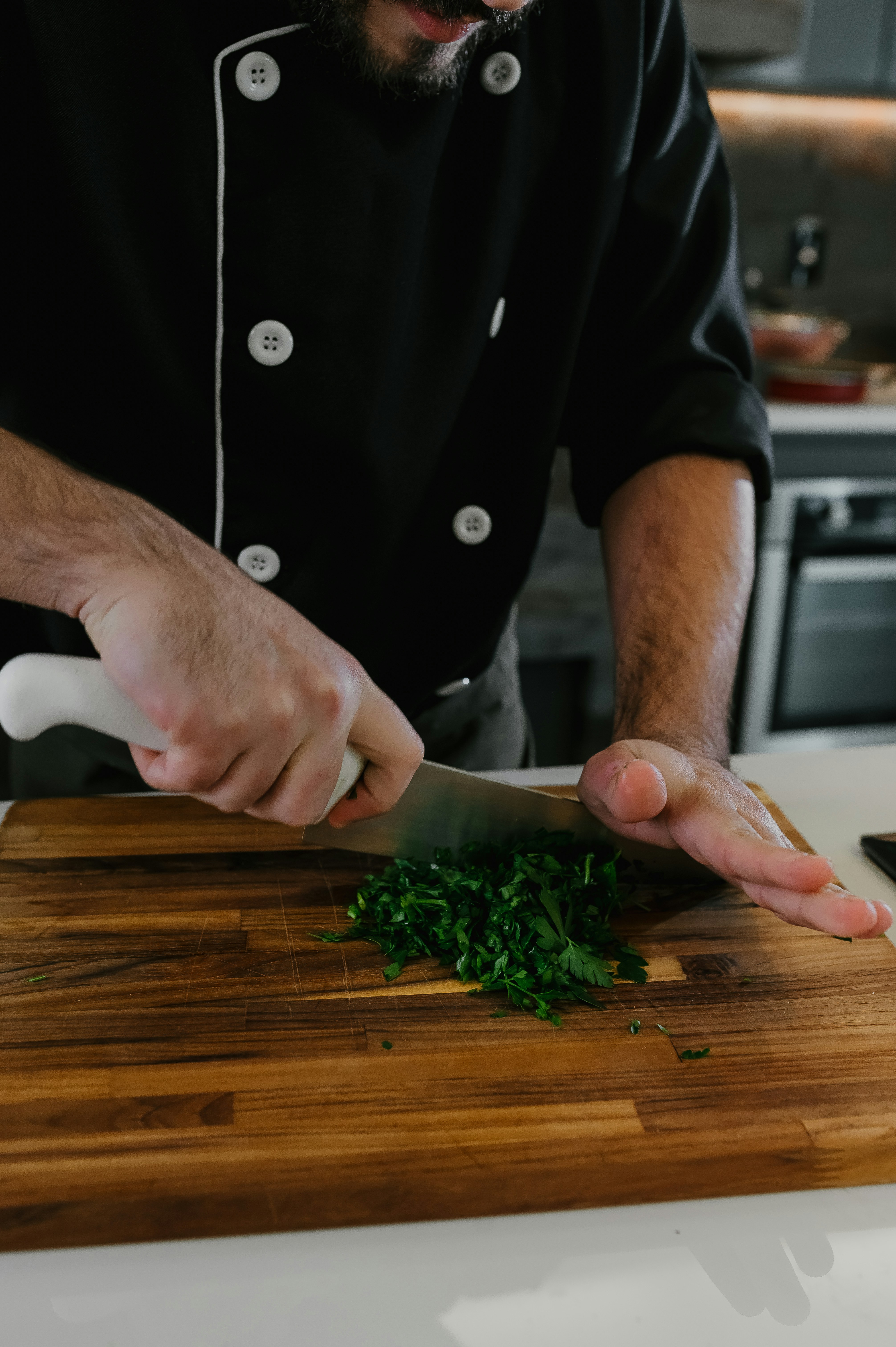 Professional chef demonstrating healthy cooking techniques with fresh vegetables