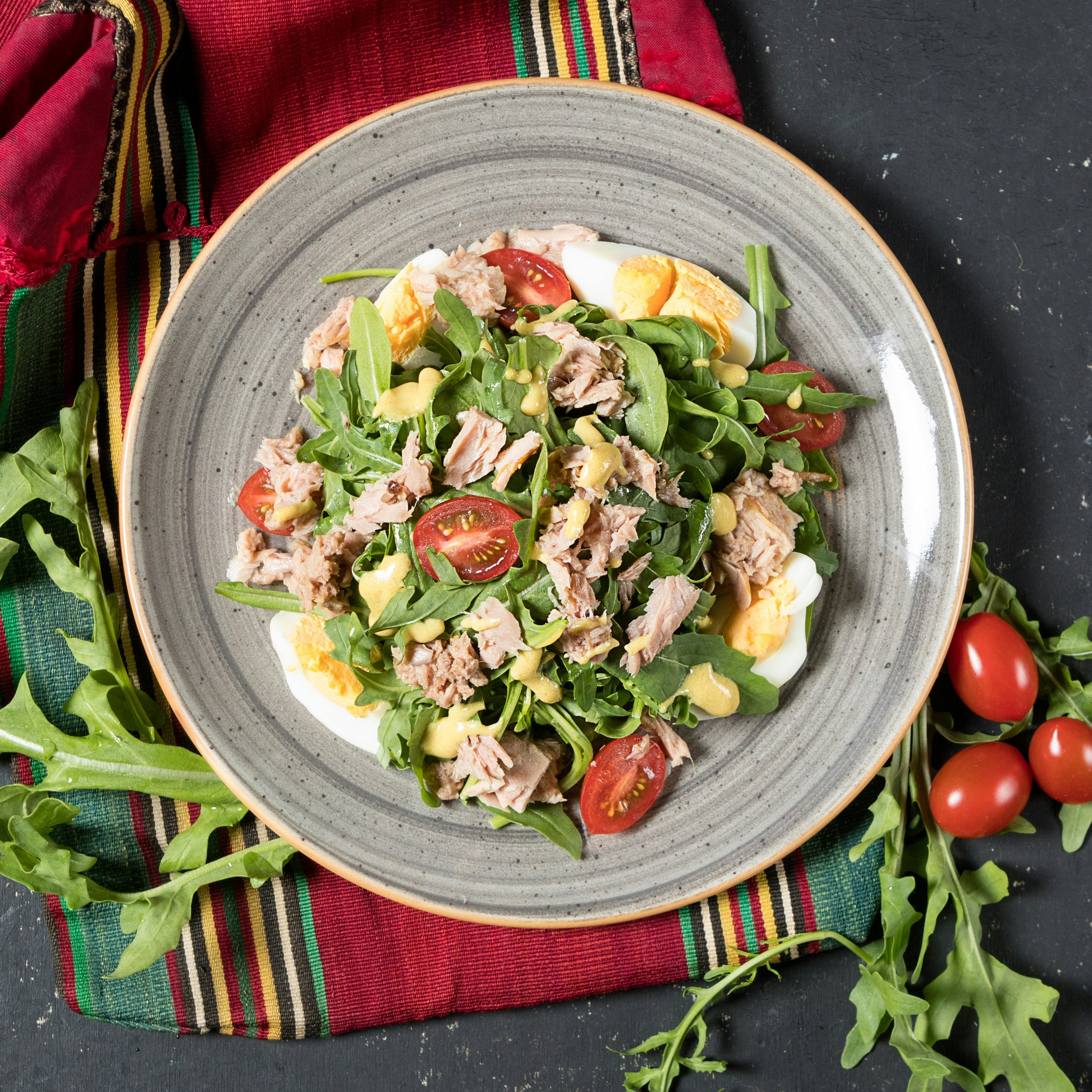 A healthy restaurant meal with grilled salmon and vegetables