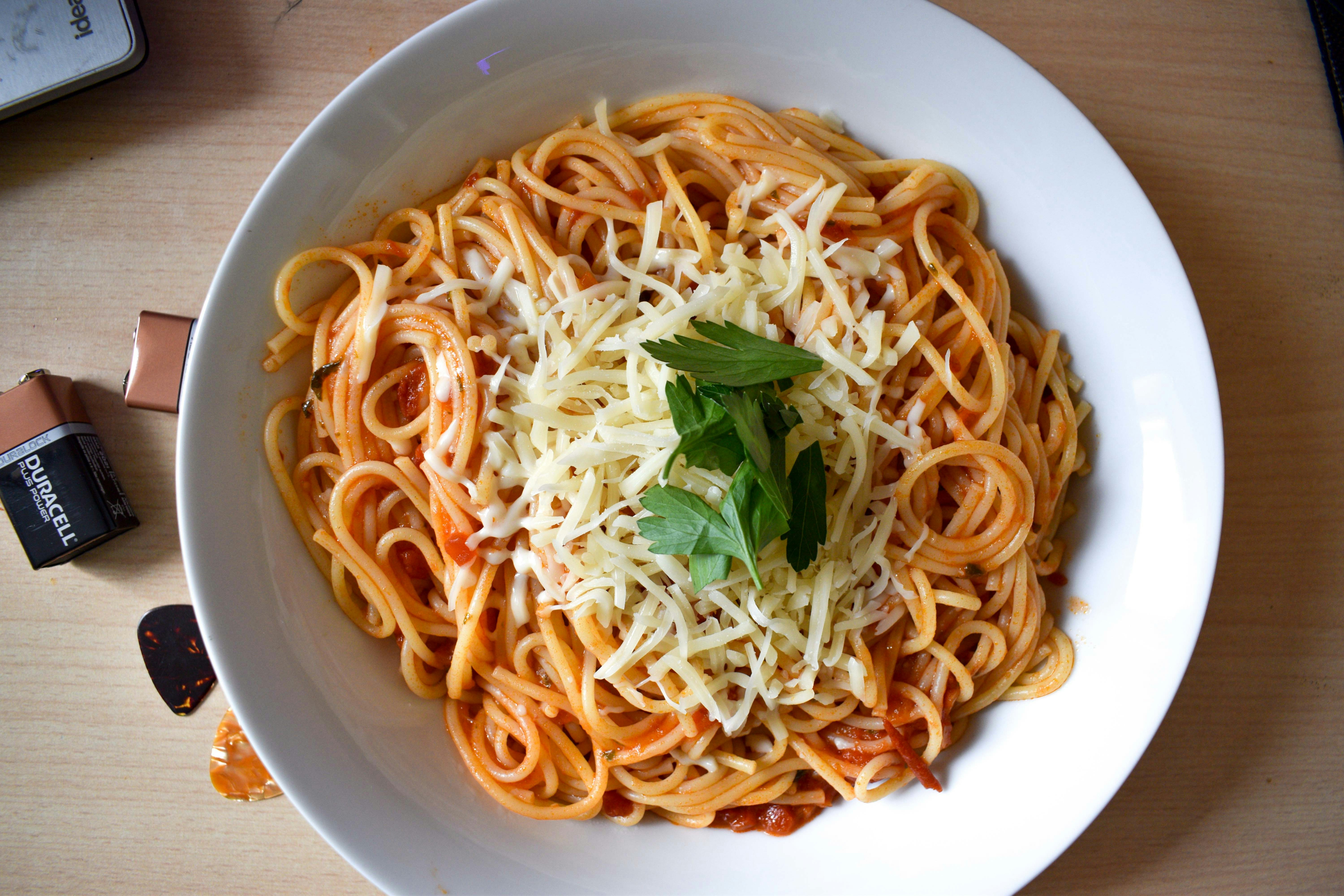 Homemade pasta with fresh tomato sauce and basil