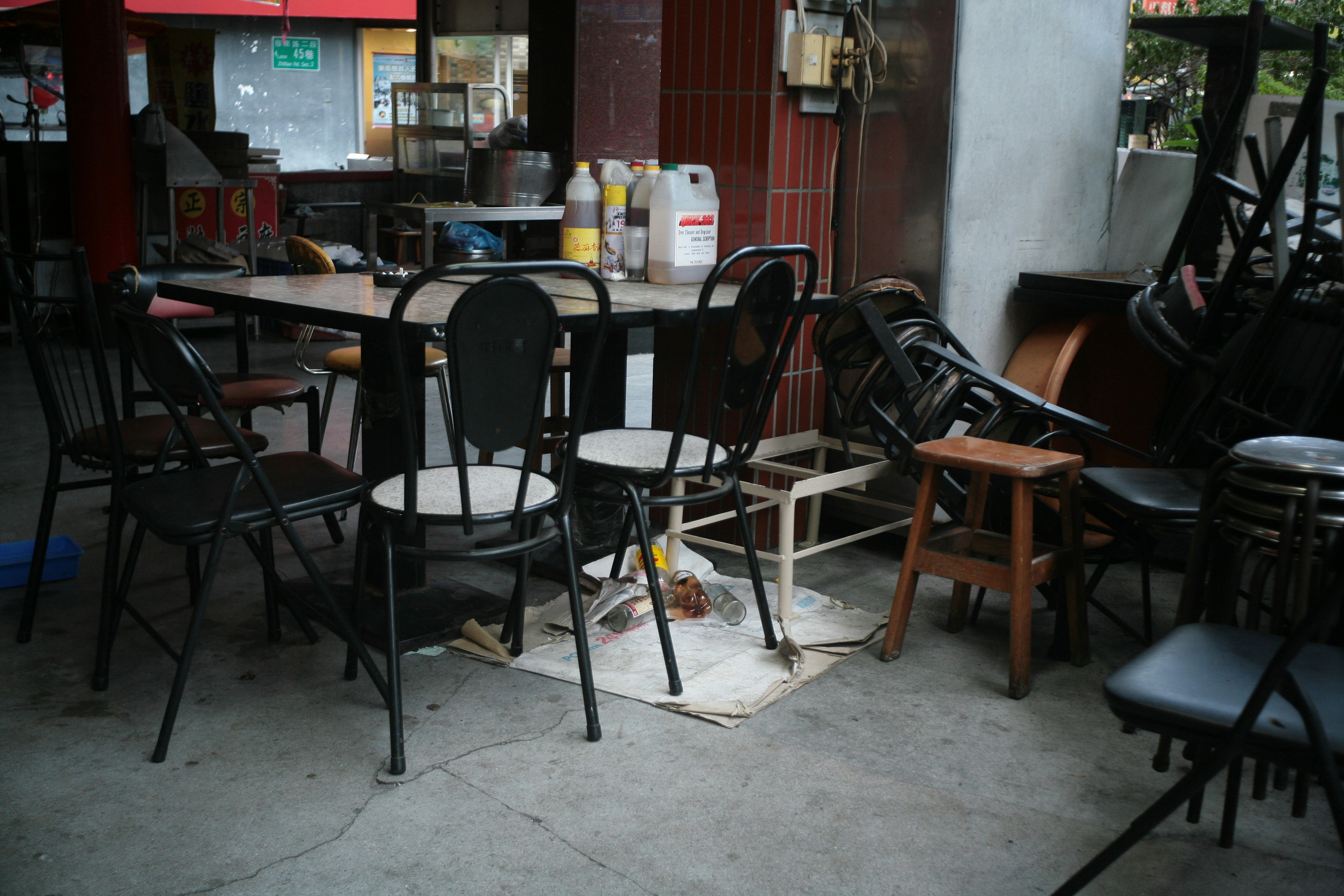 Empty restaurant with poor lighting and dirty tables